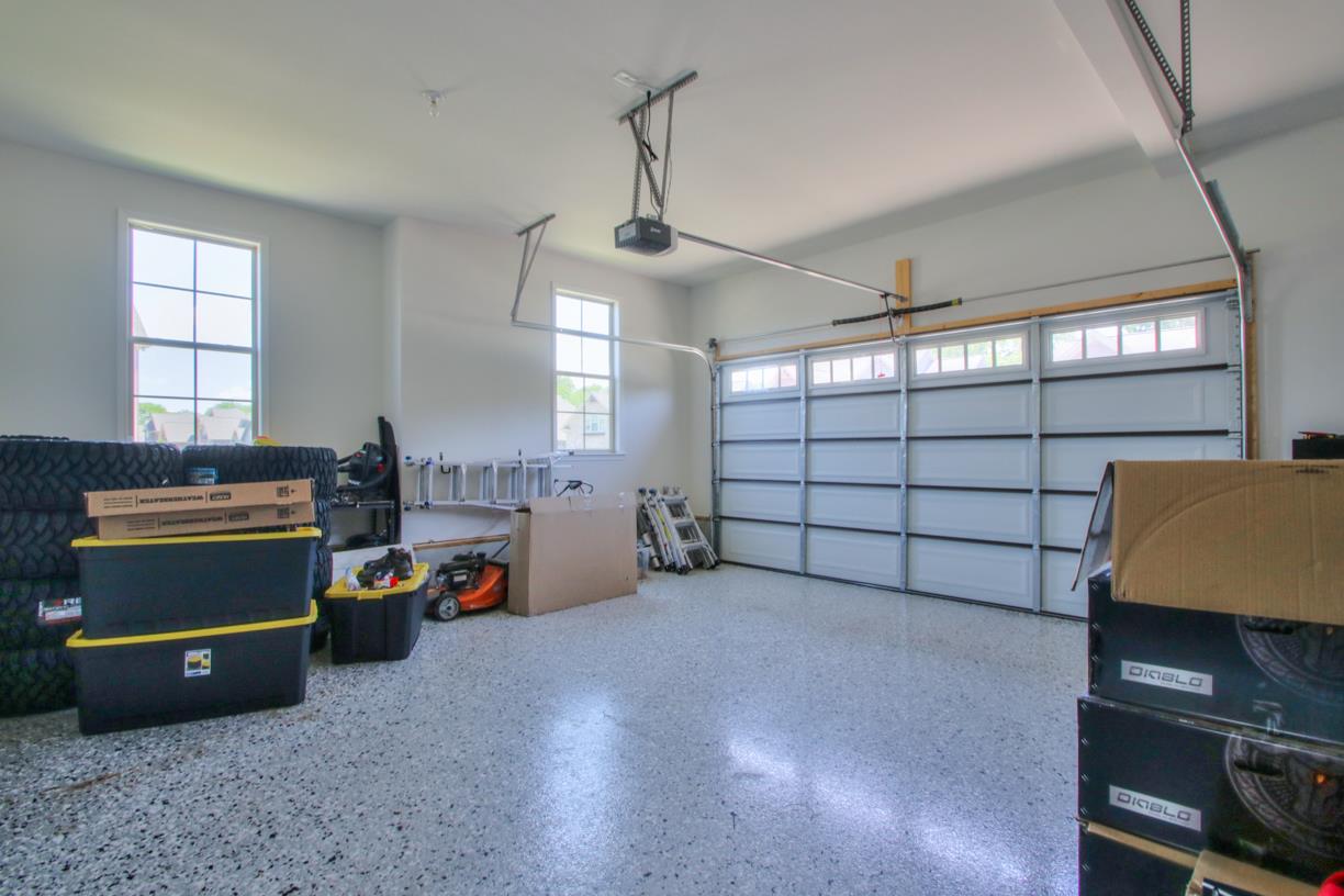 8001 Ragusa Circle Spring Hill, TN 37174 - Photo 27 of 30 Garage has epoxy floor and lots of space! The driveway is an extra car length wide too!