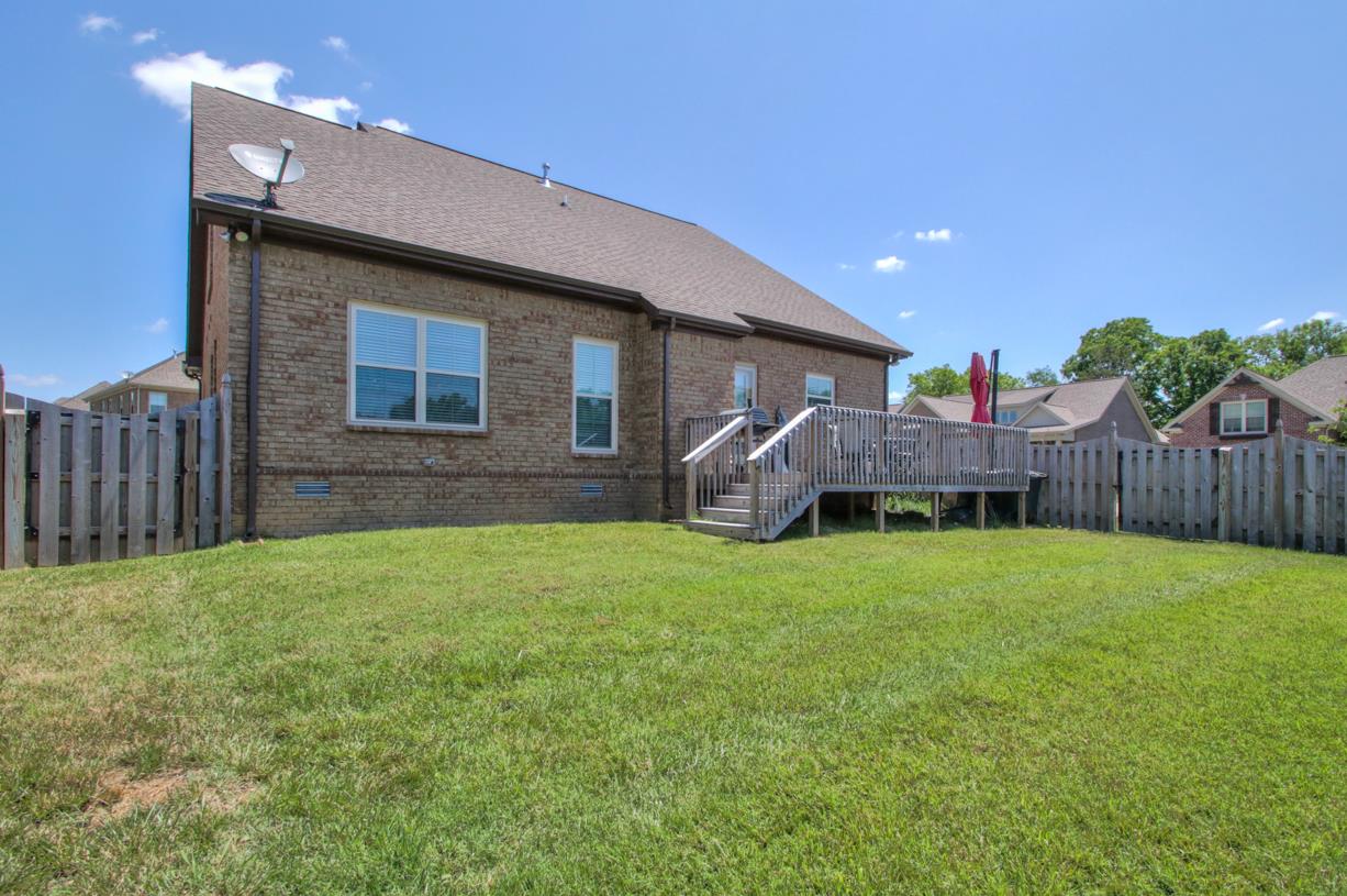 8001 Ragusa Circle Spring Hill, TN 37174 - Photo 28 of 30 Deck great for grilling out on! The yard is fenced and ready for kids and pets!