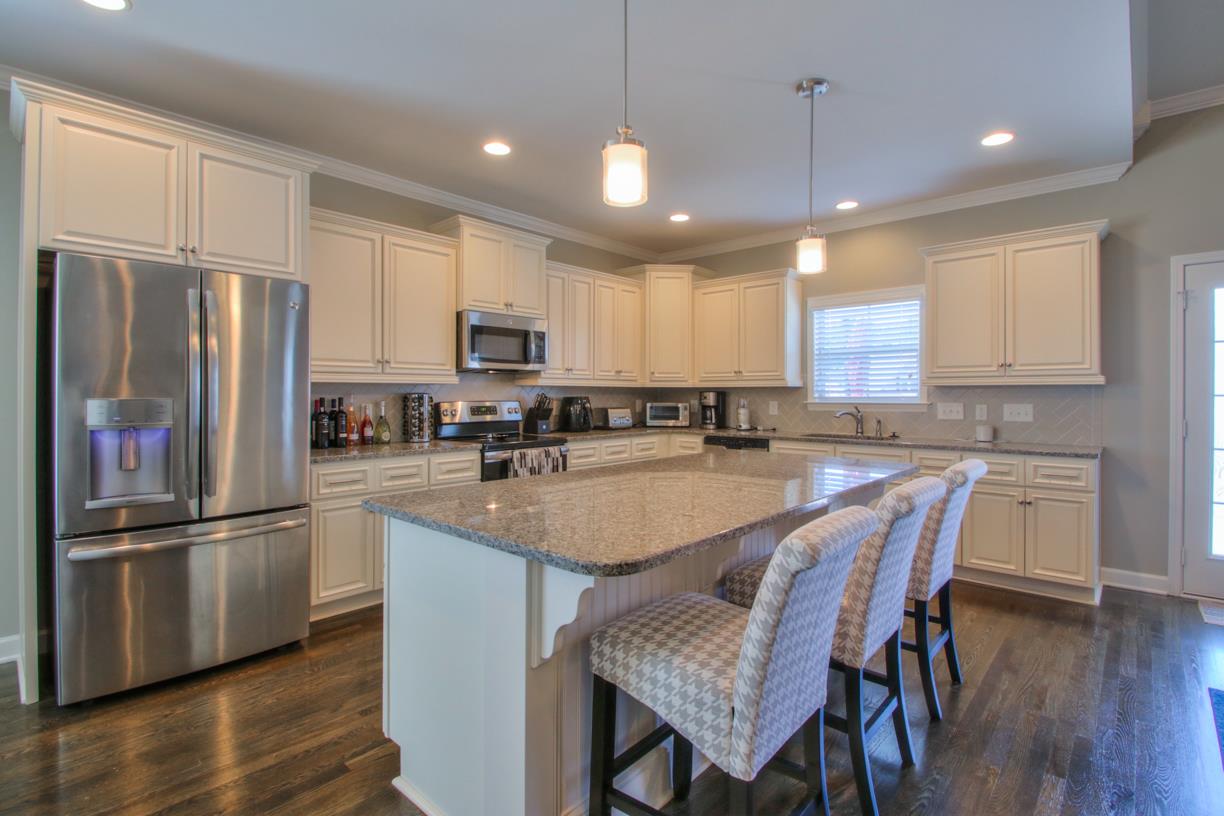 8001 Ragusa Circle Spring Hill, TN 37174 - Photo 9 of 30 This kitchen is beautiful! Look at all those cabinets and that huge island!!