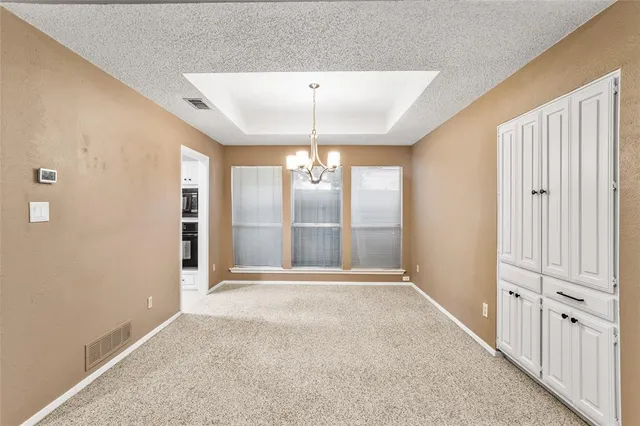 a kitchen with stainless steel appliances a refrigerator sink and cabinets