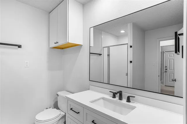 a view of hallway with wooden floor