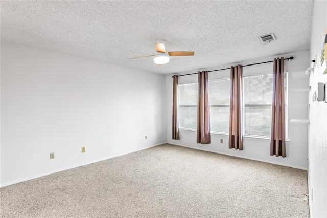 a bathroom with a sink double vanity granite tub shower and a mirror