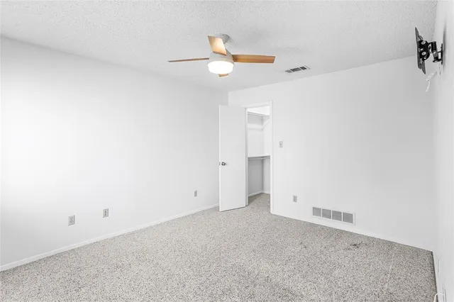 a view of a patio with couches table and chairs and potted plants