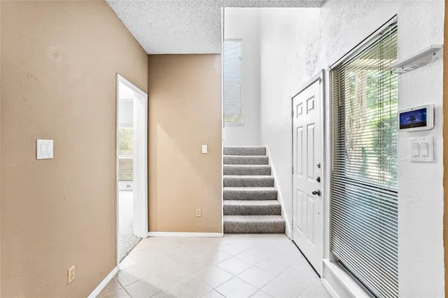 a view of a entryway with stairs and a window