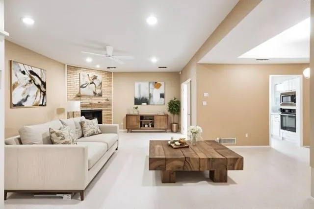 a living room with furniture and a fireplace