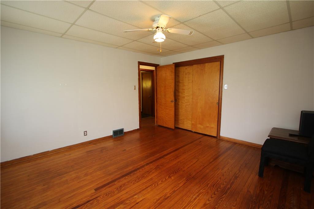269 Rte 481 Fredericktown, PA 15333 - Photo 8 of 30 Beautiful Hardwood Floors in 13x13 Primary Bedroom w/ Ceiling Fan Light & Double Closet Sliding Doors