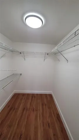 a view of a room with racks on the wall