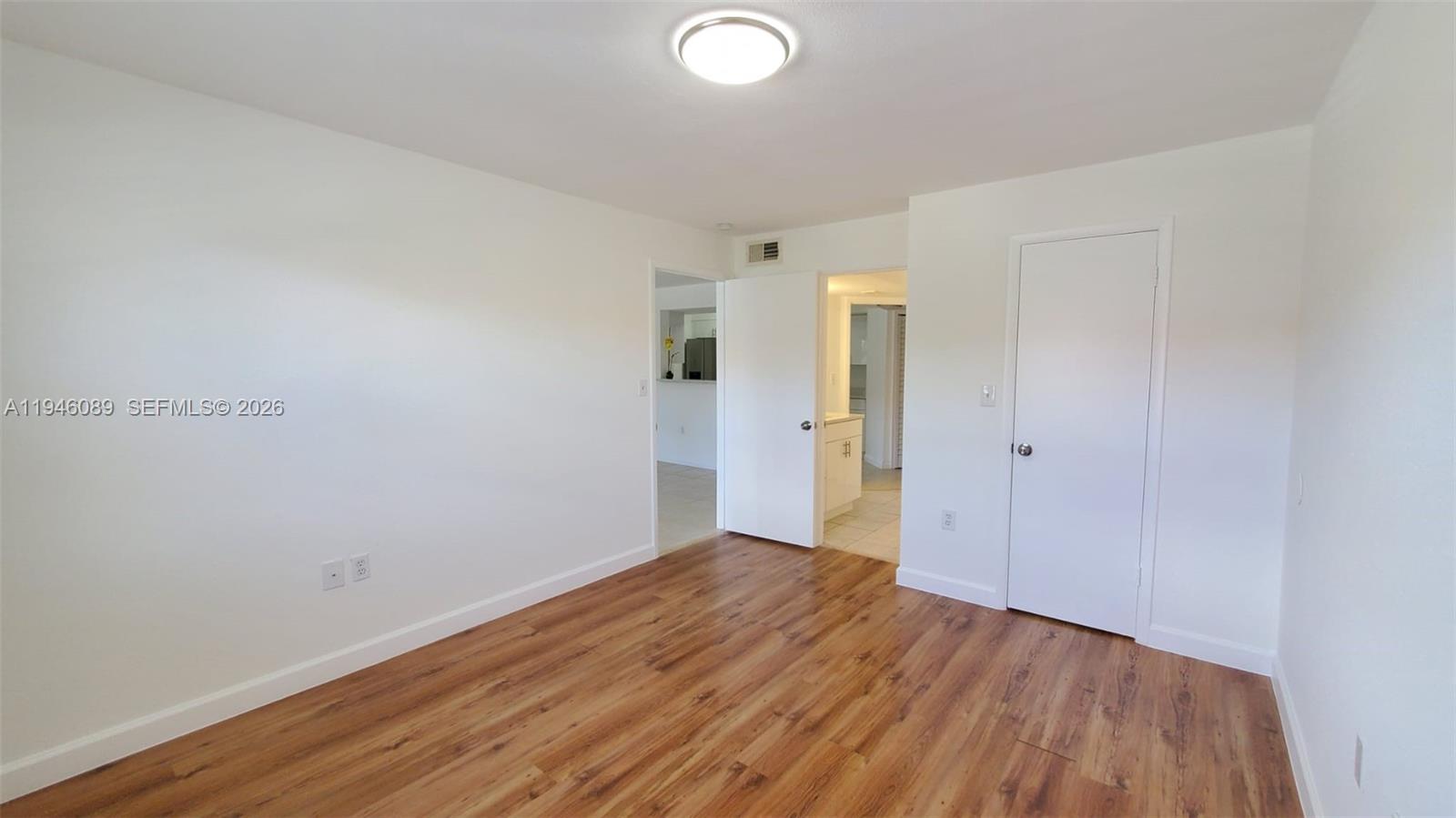 10500 Southwest 155th Court, Unit 1022 Miami, FL 33196 - Photo 20 of 41 wooden floor in an empty room