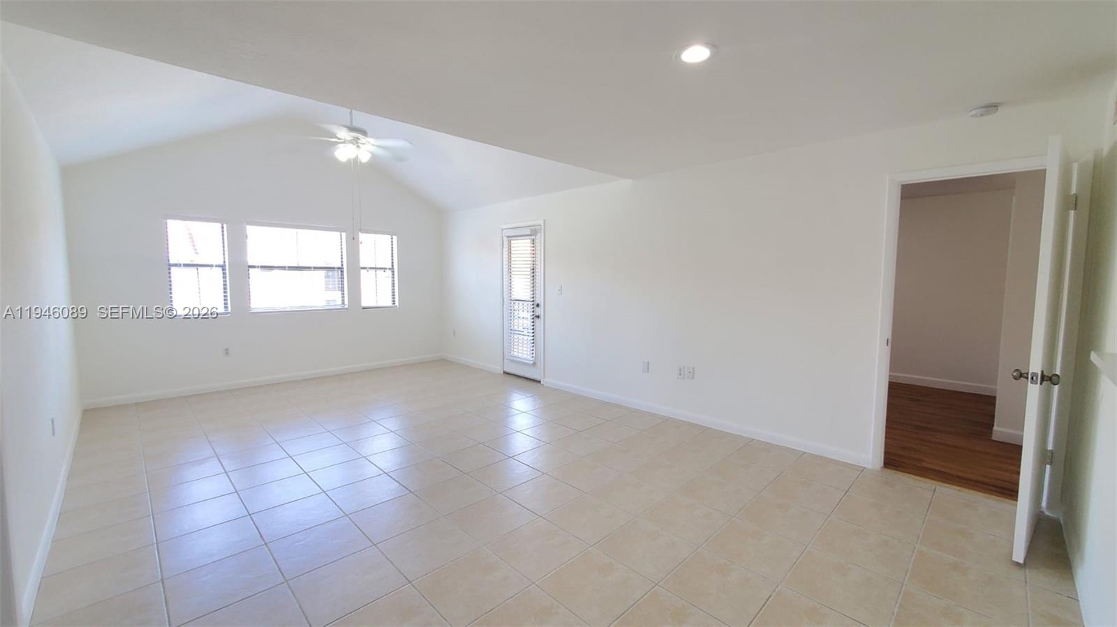 10500 Southwest 155th Court, Unit 1022 Miami, FL 33196 - Photo 2 of 41 an empty room with windows and closet