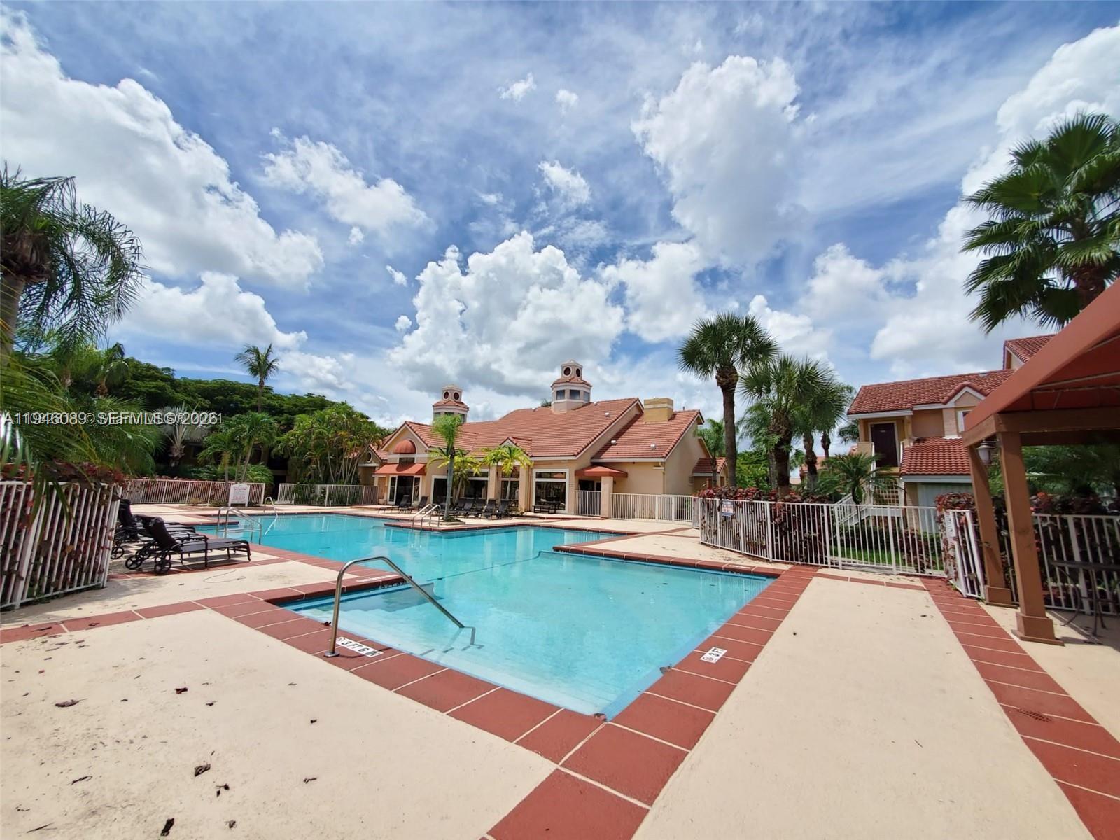 10500 Southwest 155th Court, Unit 1022 Miami, FL 33196 - Photo 39 of 41 an outdoor space with swimming pool and furniture