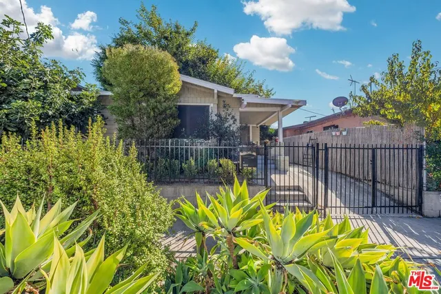 a view of a garden with a patio