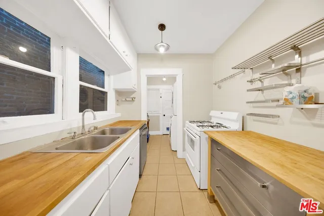 a kitchen that has a lot of cabinets in it