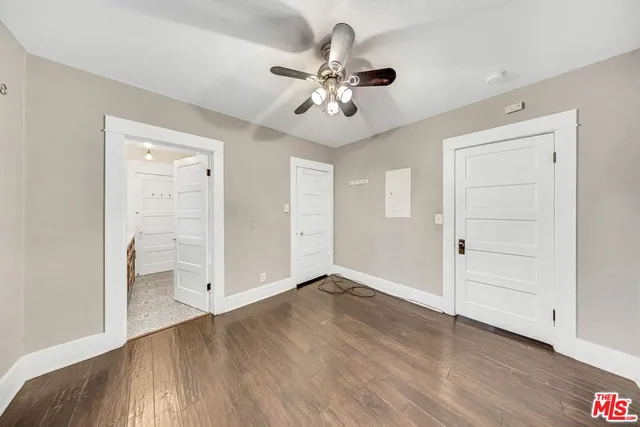 a bathroom with a granite countertop double vanity sink and a mirror