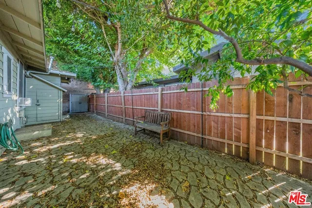 a view of a backyard of the house