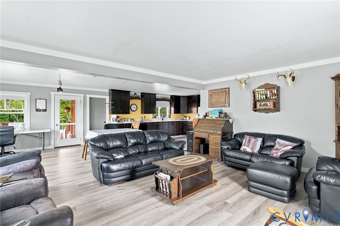 1451 Dixie Hill Road Dillwyn, VA 23936 - Photo 11 of 51 Open-concept living space featuring wood-finish fl