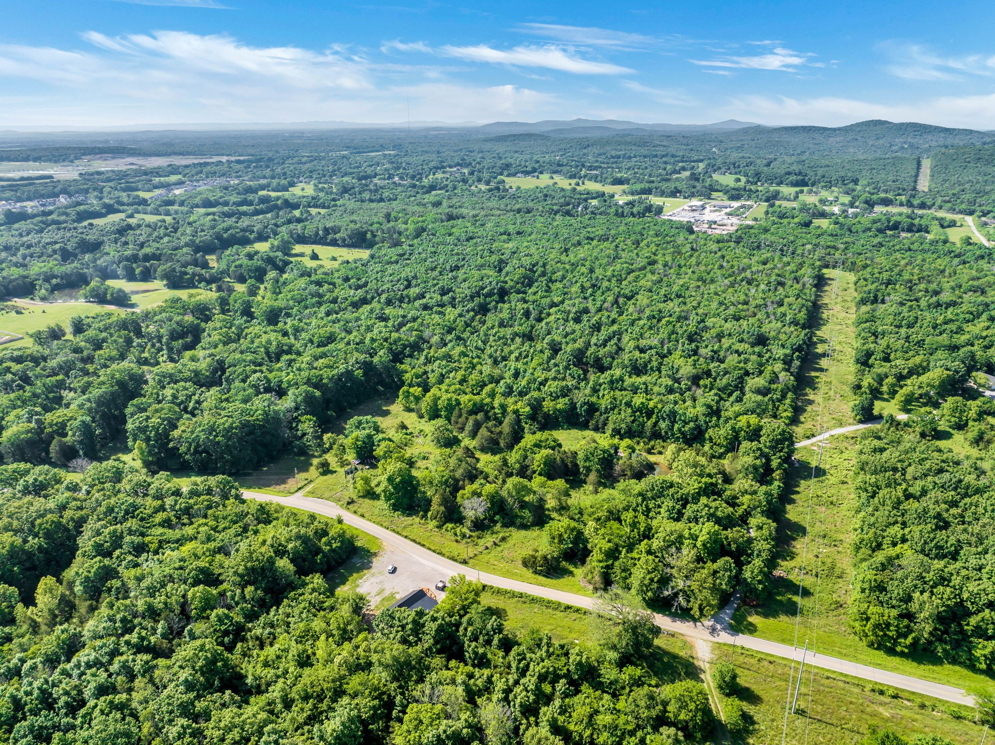 5471 Shores Road Murfreesboro, TN 37128 - Photo 10 of 14 a view of a green field with lots of bushes