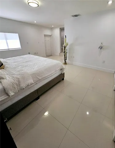 a bathroom with a sink a mirror and shower