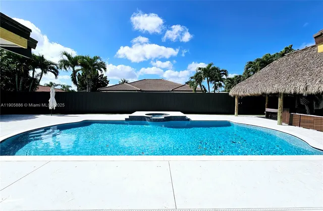 a view of outdoor kitchen with swimming pool
