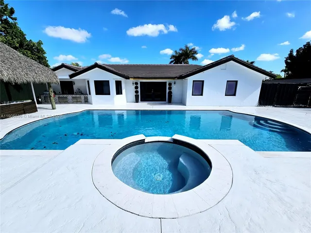 a view of a house with swimming pool