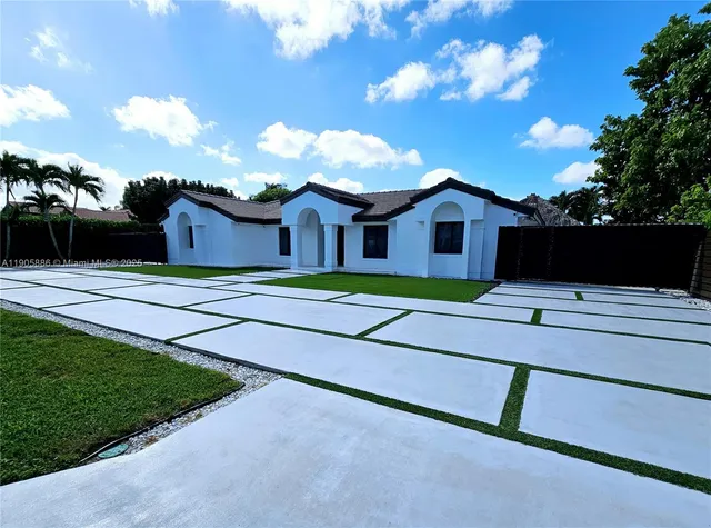 a view of house with yard