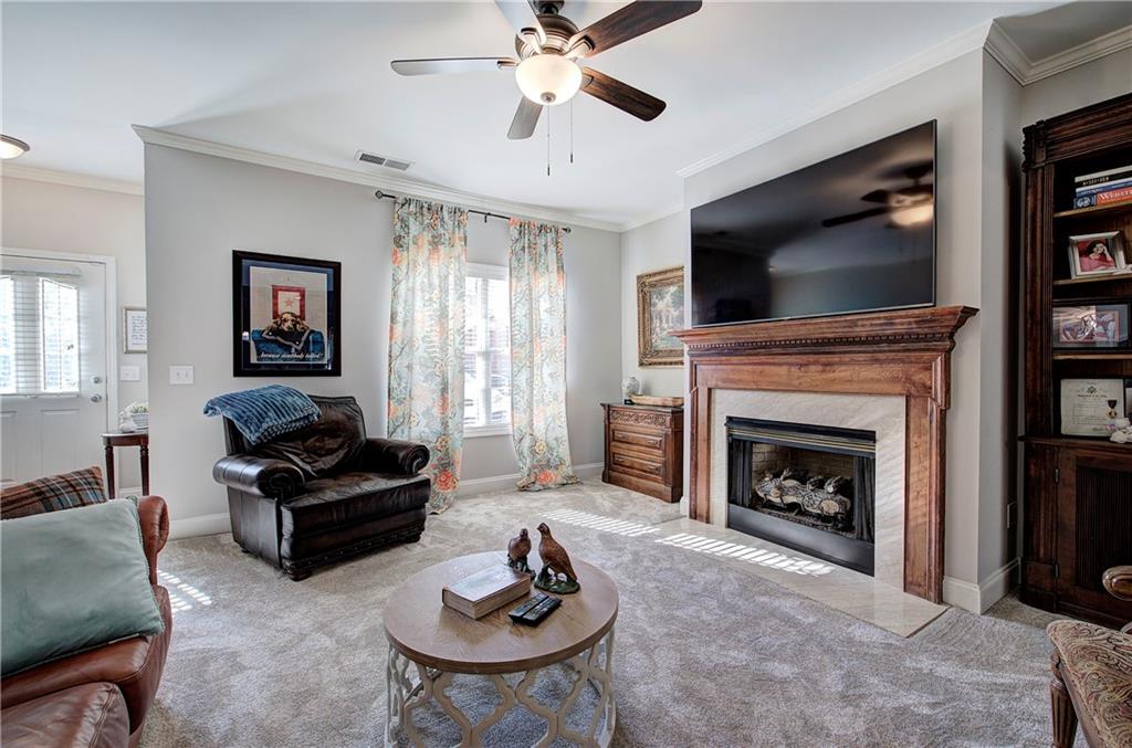 618 Manor Way Cartersville, GA 30120 - Photo 7 of 35 a living room with furniture a flat screen tv and a fireplace