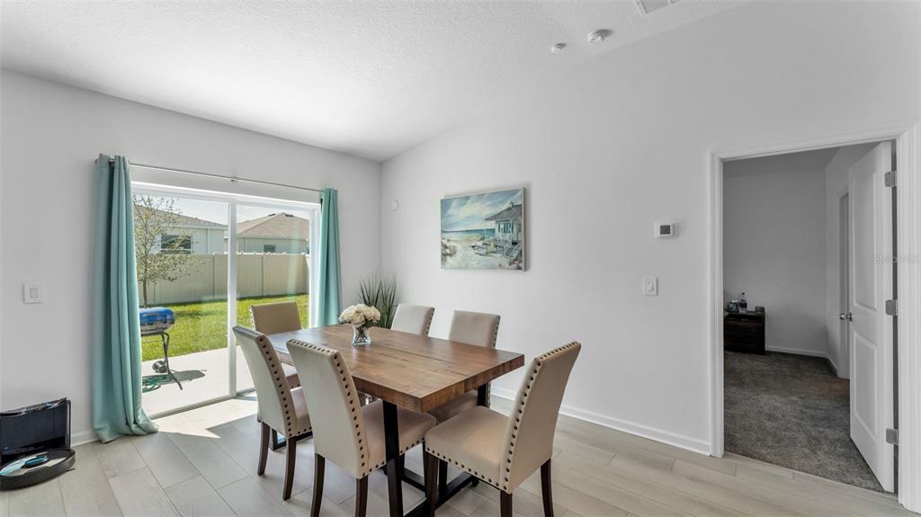1624 Marksman Road Eagle Lake, FL 33839 - Photo 11 of 42 a view of a dining room with furniture window and wooden floor