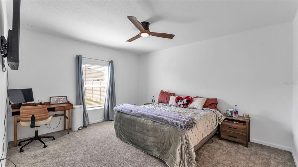 1624 Marksman Road Eagle Lake, FL 33839 - Photo 15 of 42 a bedroom with a bed and a window
