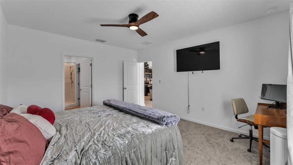 1624 Marksman Road Eagle Lake, FL 33839 - Photo 16 of 42 a bedroom with a bed and a flat screen tv