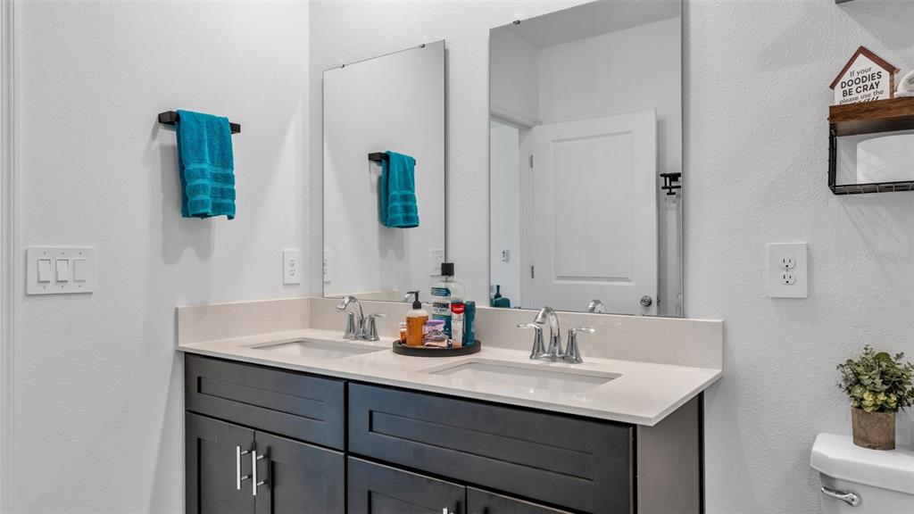 1624 Marksman Road Eagle Lake, FL 33839 - Photo 18 of 42 a bathroom with a sink and a mirror