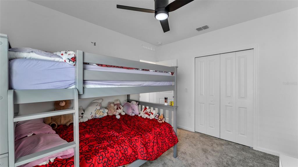 1624 Marksman Road Eagle Lake, FL 33839 - Photo 21 of 42 a bed room with a bed and a window