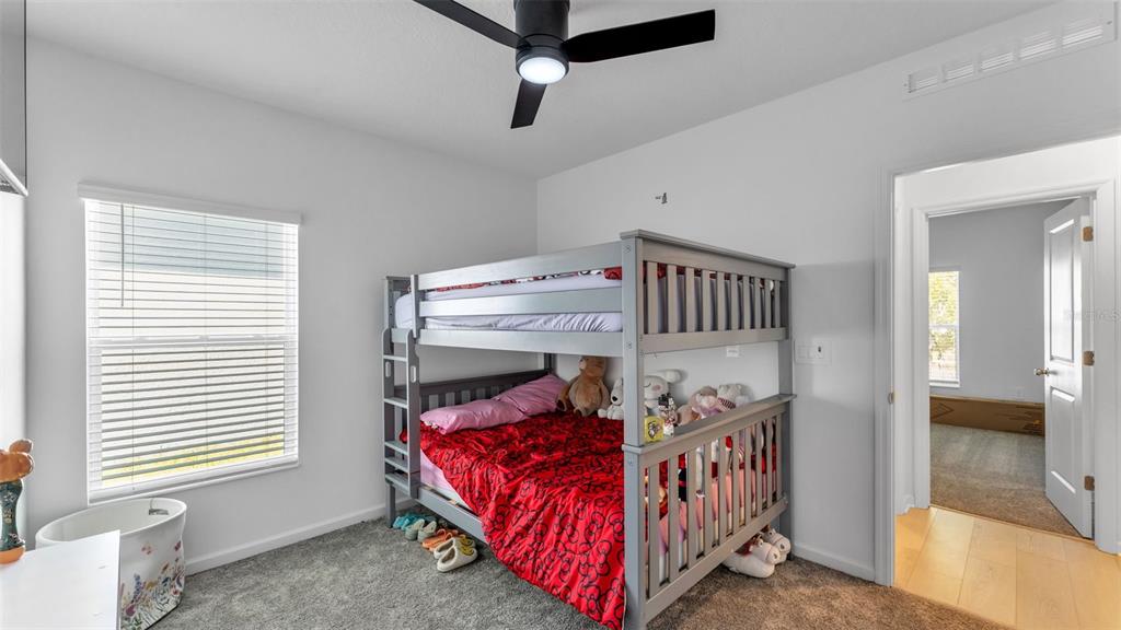 1624 Marksman Road Eagle Lake, FL 33839 - Photo 23 of 42 a bedroom with furniture and a window