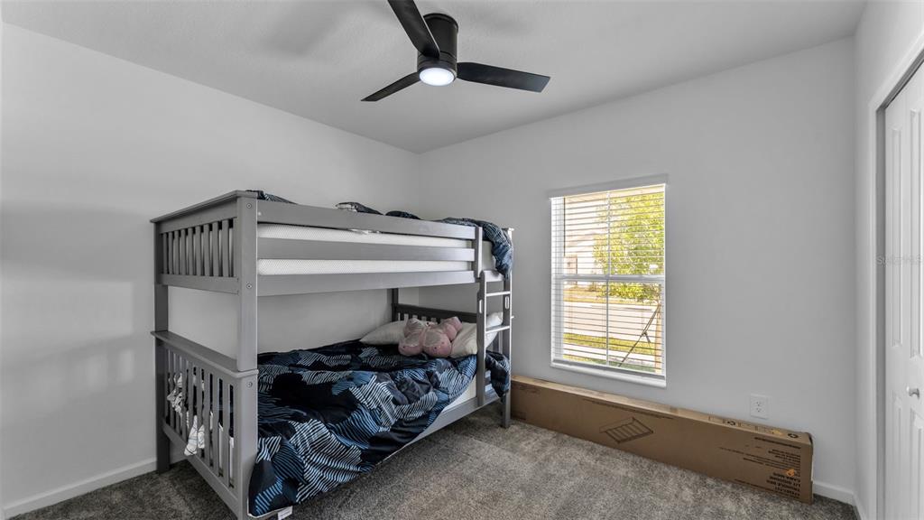 1624 Marksman Road Eagle Lake, FL 33839 - Photo 25 of 42 a bedroom with bed and a window