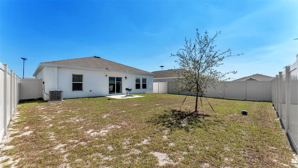 1624 Marksman Road Eagle Lake, FL 33839 - Photo 29 of 42 a bathroom with a sink and a yard