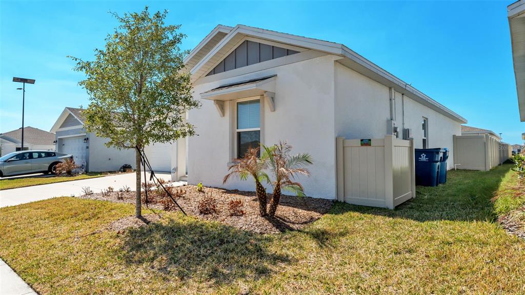 1624 Marksman Road Eagle Lake, FL 33839 - Photo 3 of 42 a front view of a house with garden