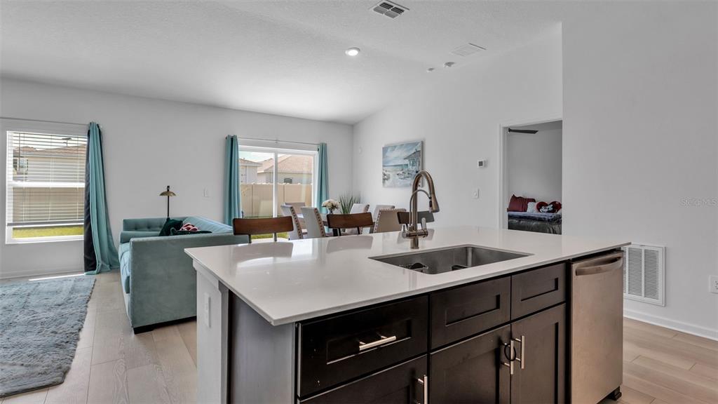 1624 Marksman Road Eagle Lake, FL 33839 - Photo 7 of 42 a kitchen with a sink and a refrigerator