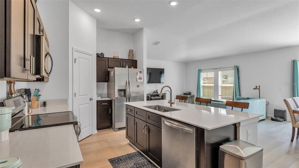 1624 Marksman Road Eagle Lake, FL 33839 - Photo 8 of 42 a kitchen with stainless steel appliances a sink stove and refrigerator