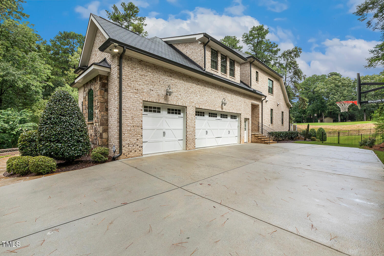 1205 Queensferry Road Cary, NC 27511 - Photo 46 of 63 a front view of a house with a yard and garage