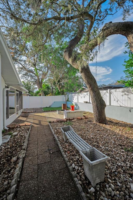 14557 Apache Avenue Largo, FL 33774 - Photo 15 of 51 a view of a yard and car parked