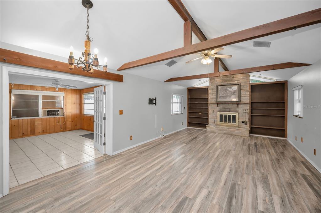 14557 Apache Avenue Largo, FL 33774 - Photo 19 of 50 a view of a livingroom with wooden floor and stairs