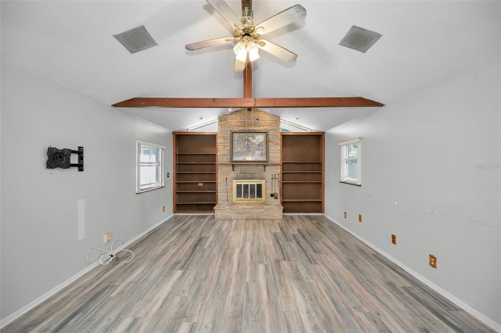 14557 Apache Avenue Largo, FL 33774 - Photo 26 of 51 a view of empty room with wooden floor and fan