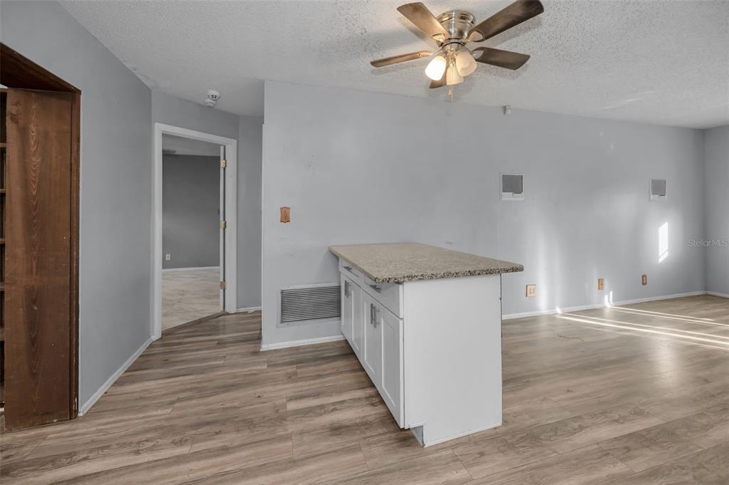 14557 Apache Avenue Largo, FL 33774 - Photo 35 of 51 a kitchen with a sink and cabinets