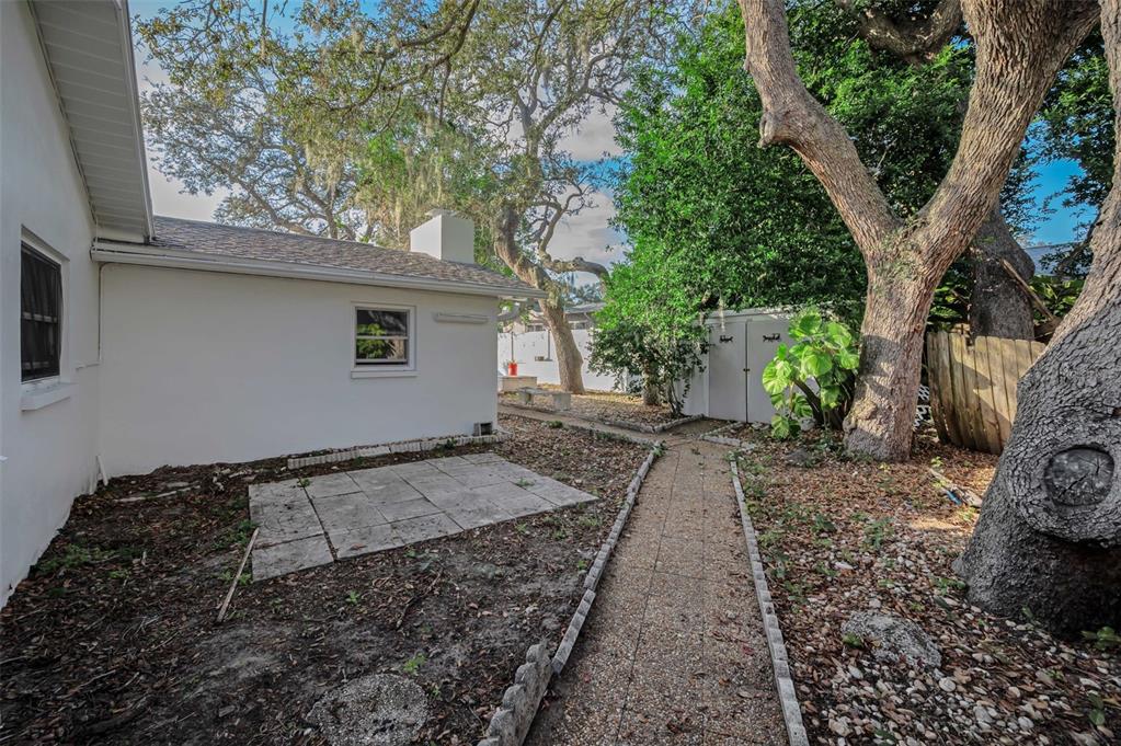 14557 Apache Avenue Largo, FL 33774 - Photo 45 of 50 a backyard of a house with lots of green space