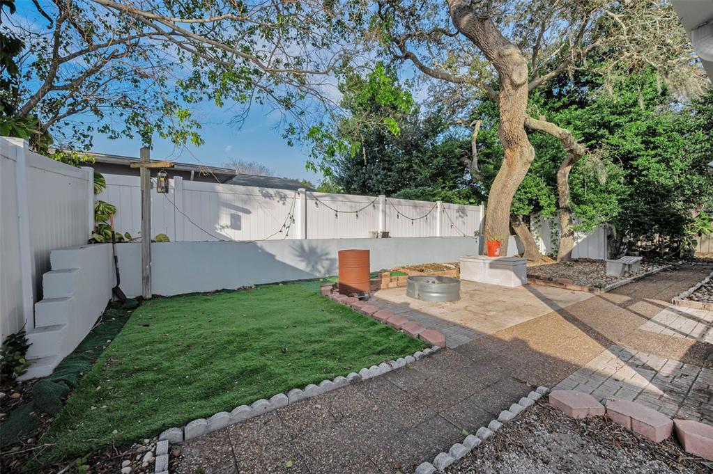 14557 Apache Avenue Largo, FL 33774 - Photo 8 of 51 a view of backyard with swimming pool