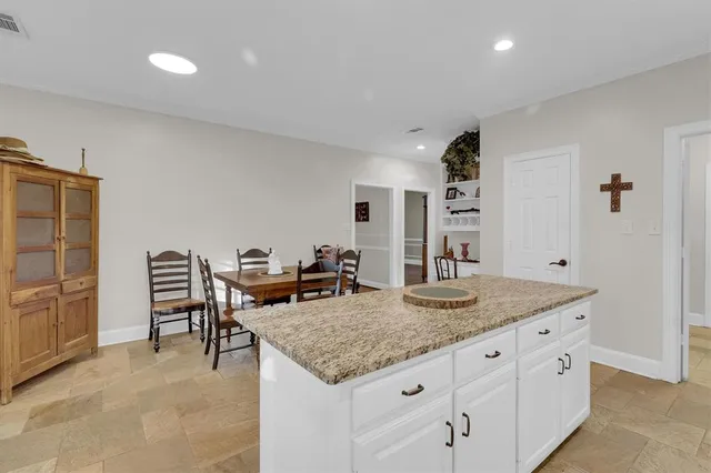a living room with granite countertop furniture and fireplace