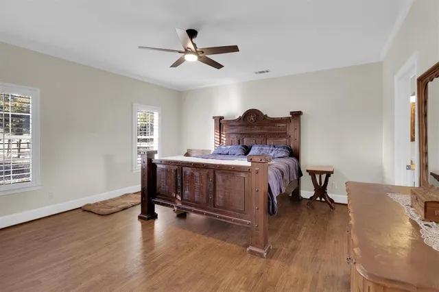 a bed room with a bed and a window