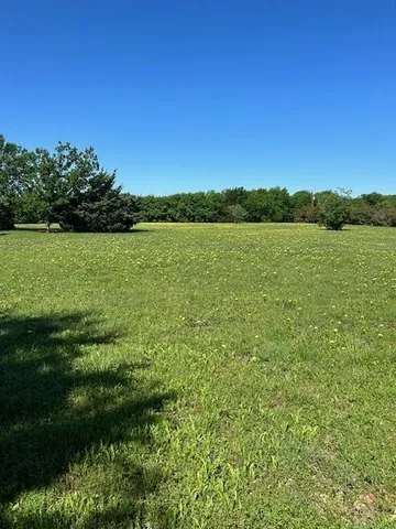 a view of a lake with a yard