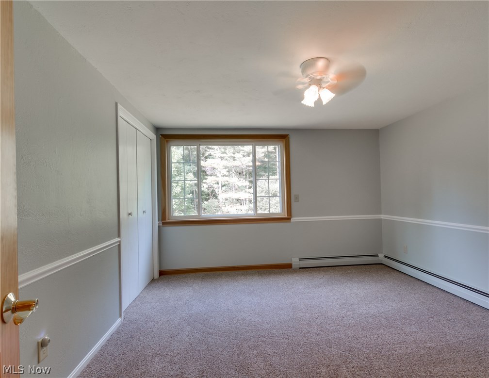 11148 Kile Road Chardon, OH 44024 - Photo 24 of 32 another view of a bedroom with full sized windows for great views and chair rail to make everything classy!