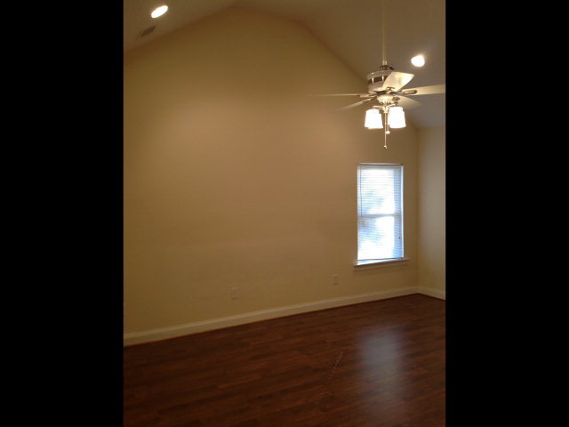 4775 Brookhaven Road Macon, GA 31206 - Photo 14 of 16 a view of a livingroom with a chandelier fan and wooden floor