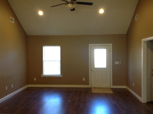 4775 Brookhaven Road Macon, GA 31206 - Photo 3 of 16 an empty room with wooden floor and windows