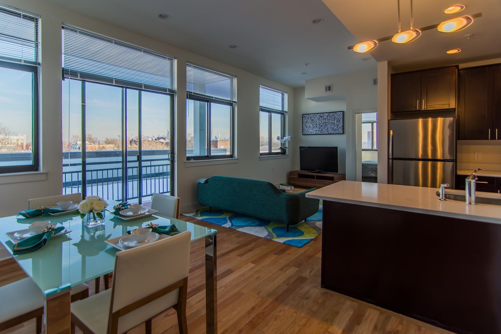 a view of a livingroom with furniture and a flat screen tv